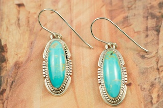 Genuine Manassa Turquoise set in Sterling Silver French Wire Earrings. This Turquoise is also referred to as King�s Manassa Turquoise. The Manassa Turquoise mine is located in Manassa, Conejos County, Colorado. Created by Navajo Artist Larson Lee. Signed.